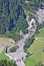 Aerial view of mountain stream in the Austrian Alps blocked after a massive mudflow with excavator and truck working to clean up Royalty Free Stock Photo