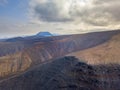 Aerial view of the mountainous coasts of the island of Lanzarote, Canary Islands, Spain. Africa. La Corona volcano on the horizon Royalty Free Stock Photo