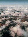 Aerial view on the mountains from the airplane window. Cloudy day. Background picture.