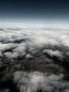 Aerial view on the mountains from the airplane window. Cloudy day. Background picture.