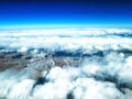 Aerial view of mountains and clouds on top Royalty Free Stock Photo