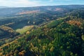 Aerial view of mountains covered with autumn forest Royalty Free Stock Photo