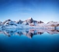 Aerial view at the mountains and reflection on the water surface. Lofoten islands, Norway. Royalty Free Stock Photo