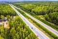 Aerial view of movement of cars on the motorway through forest