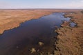 Aerial view, moving forward above the branches river is a Danube river flows among the endless thickets of reed Royalty Free Stock Photo