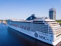 Aerial view of the MSC Orchestra cruise ship docked in Riga by the old town.