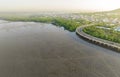 Aerial view of mudflat, mangrove forest, and sustainable city and green mangrove forest. Mangroves capture CO2 from the atmosphere