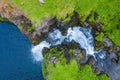 Aerial view of Mulafossur waterfall in Gasadalur village in Faroe Islands, North Atlantic Ocean. Photo made by drone from above.