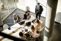 Aerial view at multiethnic group of business people working together and preparing new project on a meeting in office Royalty Free Stock Photo