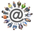 Aerial View of Multiethnic People Forming Circle and 'At' Symbol Royalty Free Stock Photo