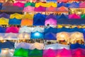 Aerial view of multiple colour of flea market roof top