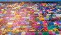 Aerial view multiple colour flea market rooftop