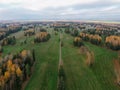 Aerial view of nap park in pavlovsk, golden autumn, tree tops from a bird's eye view, golden crowns of trees, path Royalty Free Stock Photo