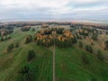 Aerial view of nap park in pavlovsk, golden autumn, tree tops from a bird's eye view, golden crowns of trees, path Royalty Free Stock Photo