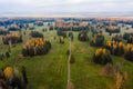 Aerial view of nap park in pavlovsk, golden autumn, tree tops from a bird's eye view, golden crowns of trees, path in Royalty Free Stock Photo