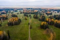 Aerial view of nap park in pavlovsk, golden autumn, tree tops from a bird's eye view, golden crowns of trees, path in Royalty Free Stock Photo