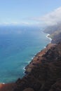 An aerial view of the Napali Coastline and the Pacific Ocean with boats sailing in the water in Kauai Royalty Free Stock Photo