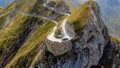 Aerial view of a narrow winding road at the top of a rocky mountain Royalty Free Stock Photo