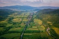 Aerial view of the narrow winding road through the wooded Carpathian mountains, rural landscape, outdoor travel background Royalty Free Stock Photo