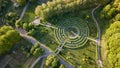 Aerial view a natural labyrinth in the botanical garden on a sunny day