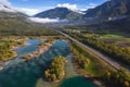 Aerial view of natural landscapes and highway asphalt road along lakes and mountains Royalty Free Stock Photo