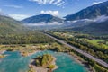 Aerial view of natural landscapes and highway asphalt road along lakes and mountains Royalty Free Stock Photo