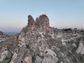 Aerial view of natural rock formations in the sunset, valley with cave houses in Cappadocia, Turkey. Natural landscape Royalty Free Stock Photo