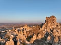 Aerial view of natural rock formations in the sunset, valley with cave houses in Cappadocia, Turkey. Natural landscape Royalty Free Stock Photo