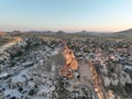 Aerial view of natural rock formations in the sunset, valley with cave houses in Cappadocia, Turkey. Natural landscape Royalty Free Stock Photo