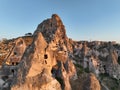 Aerial view of natural rock formations in the sunset, valley with cave houses in Cappadocia, Turkey. Natural landscape Royalty Free Stock Photo