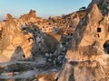 Aerial view of natural rock formations in the sunset, valley with cave houses in Cappadocia, Turkey. Natural landscape Royalty Free Stock Photo