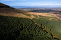 Aerial view on nature scene with green forest by a mountain, cloudy sky. Sligo area, Ireland. Warm sunny day. Country side. Irish