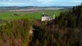 Aerial view Neuschwanstein Castle and bridge Marienbrucke across Pollat gorge in Ammergau Alps. View of famous