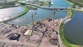 Aerial view of new developing residense in american city suburbs. Tower crane at industrial construction site. Concept