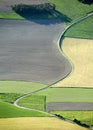 Aerial View : Nice curved road in the fields Royalty Free Stock Photo