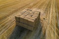 Aerial view of nicely stacked rectangle straw hay bales in the field Royalty Free Stock Photo