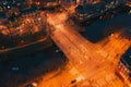 Aerial view of night Amsterdam city road intersection with bridge and water canal, view from above