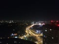 Aerial view of night city lights with road traffic. Royalty Free Stock Photo