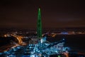 Aerial view of the night Lakhta center in green color in St. Petersburg, on the shore of the Gulf of Finland