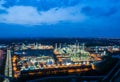 Aerial view night light oil terminal is industrial facility for storage of oil and petrochemical. oil manufacturing products ready Royalty Free Stock Photo