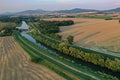 Aerial view of Nitra river flowing in lowlands of western Slovakia, with small hydroelectric plant build on it