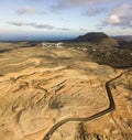 Jagged coasts and cliffs overlooking the ocean. Aerial view. Lanzarote, road leading to the Mirador del Rio.