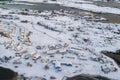 Aerial view of Norwegian fishing village in Reine City, Lofoten islands, Nordland, Norway, Europe. White snowy mountain hills, Royalty Free Stock Photo