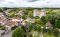 Aerial view of Nunney Castle and Nunney Fayre in Nunney, Somerset, UK