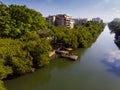 Aerial view o Marapendi canal in Barra da tijuca on a summer day. There is wooden dock, with green vegetation can be Royalty Free Stock Photo