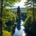 Aerial view of observation tower with Finnish flag among blue lakes and green forests in summer Finland. Aulanko