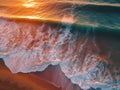 Aerial view of ocean waves breaking on sandy beach at sunset Royalty Free Stock Photo