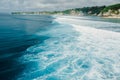 Aerial view of ocean with waves and coastline on Impossibles beach in Bali