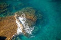 Aerial view of ocean waves and fantastic Rocky coast. The concept of calmness silence and unity with nature. Royalty Free Stock Photo