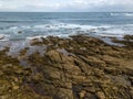 Aerial view of ocean waves and rocky coast Royalty Free Stock Photo